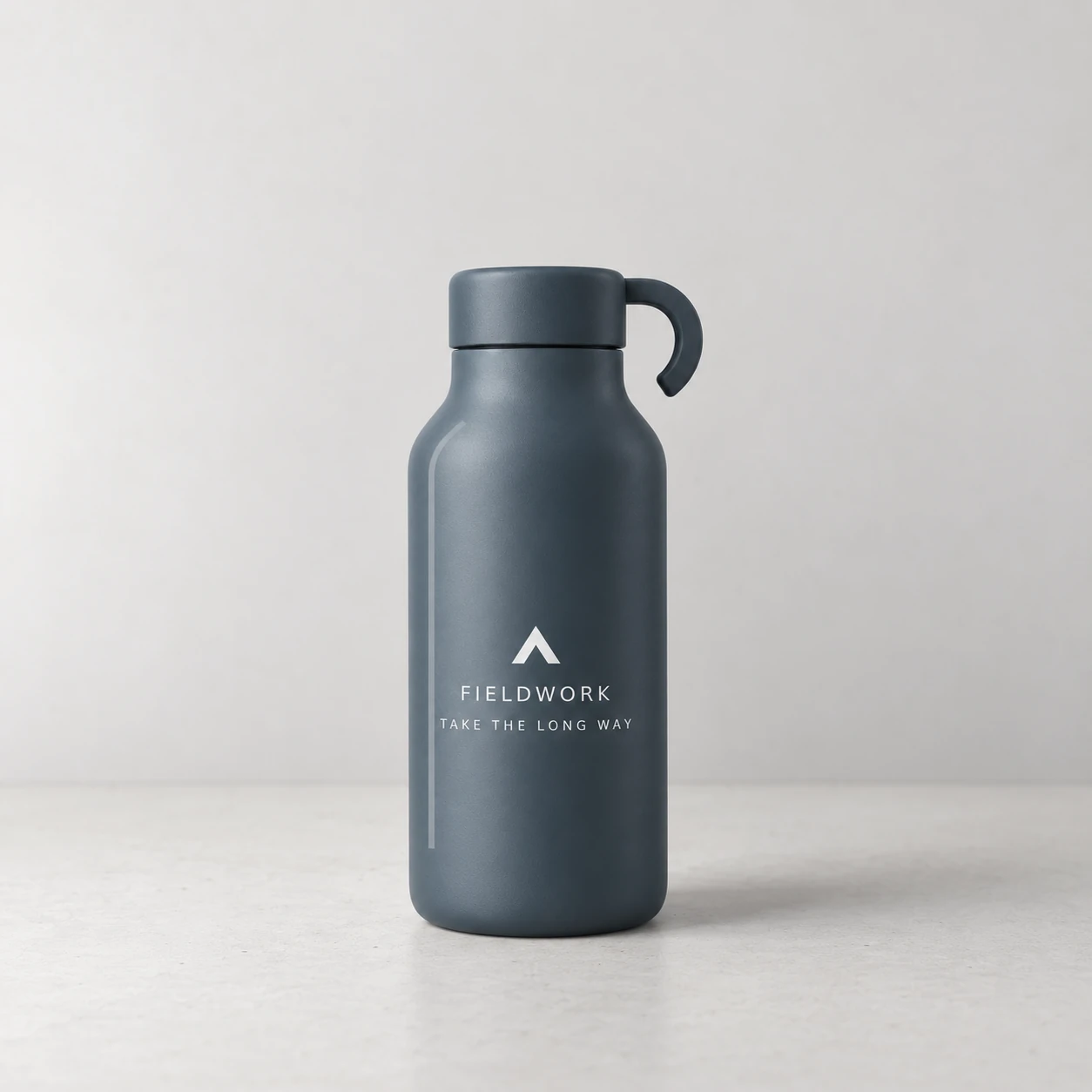 Before: the Fieldwork bottle, small on a gray tabletop.